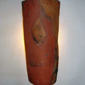 Wall-mounted lamp made from antique French roof tile (tuile canal) by Studio B3KM with indirect lighting