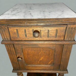 Antique French marble-top cabinet from late 19th century with provincial style turned legs and solid wood construction