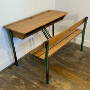 Vintage French school desk by Delagrave with integrated wooden bench and green metal legs showing natural patina