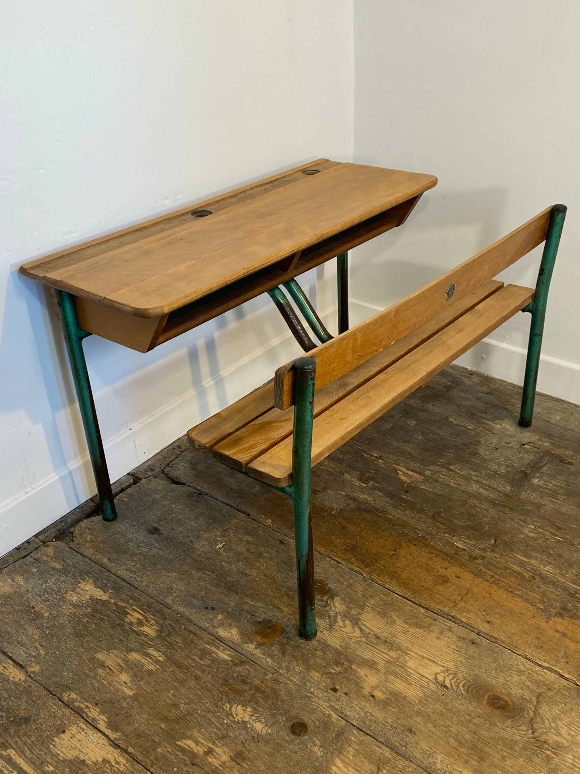 Vintage French school desk by Delagrave with integrated wooden bench and green metal legs showing natural patina