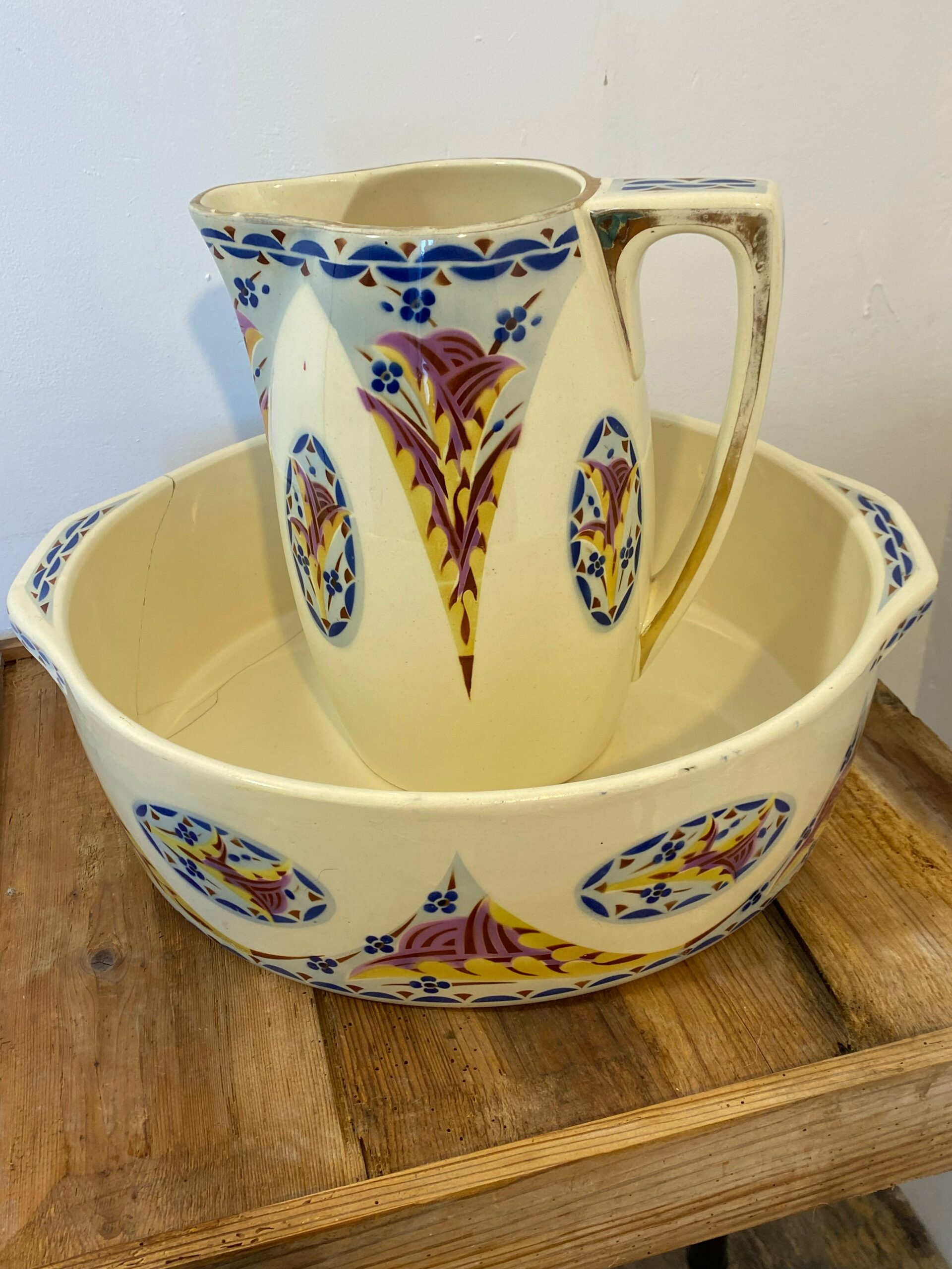 Vintage French Saint-Amand Art Deco pitcher and basin set with hand-painted orange and green floral pattern