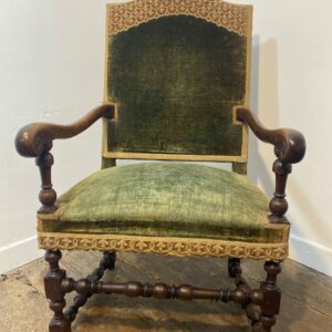 Antique Louis XIII armchair with green velvet upholstery and ornate hand-carved wood details - French baroque furniture collectible