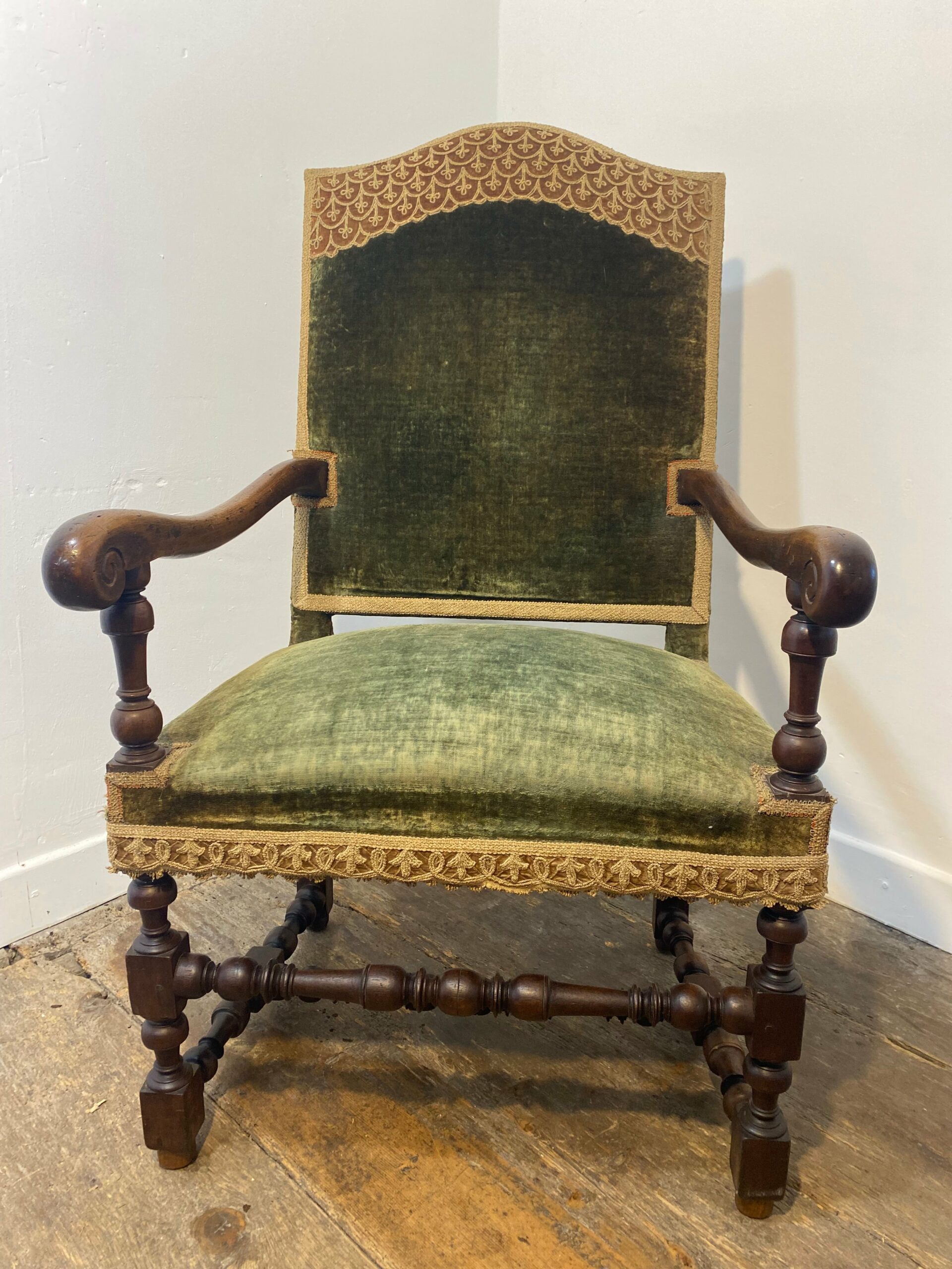Antique Louis XIII armchair with green velvet upholstery and ornate hand-carved wood details - French baroque furniture collectible