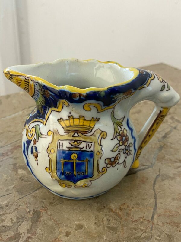 Antique French faience pitcher from Les Sables d'Olonne with hand-painted polychrome florals and Henry IV crest - late 19th century ceramic