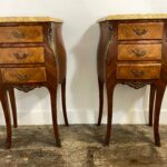 Pair of Louis XV-style bedside cabinets with veined marble tops, Rococo bombé shape design with marquetry inlays and ormolu mounts, mid-20th century French nightstands